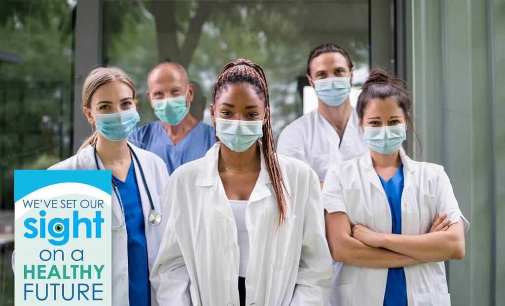 Group of doctors and nurses wearing masks in an office
